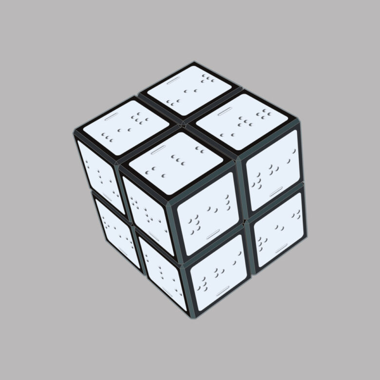 A mini version of the rubiks cube puzzle. This version of the puzzle has squares which are all white in colour. The colour is shown only by braille.